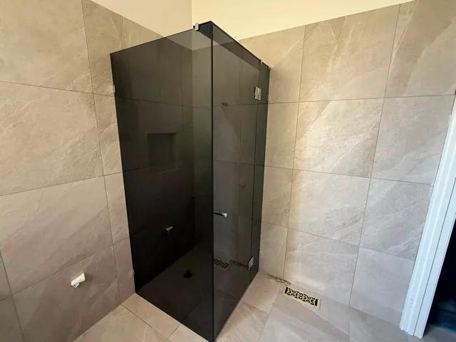 Black-framed and tinted shower screens