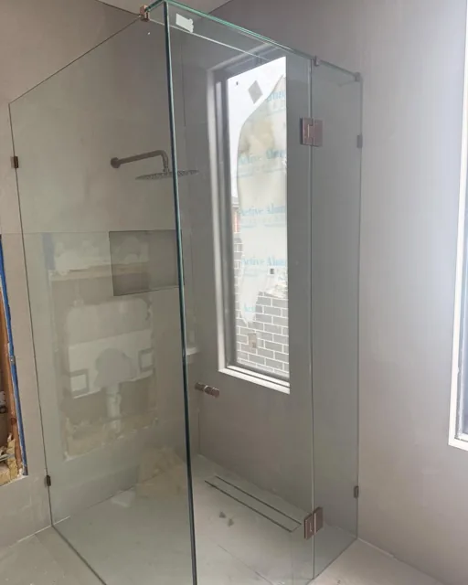 Twin shower with frameless slider